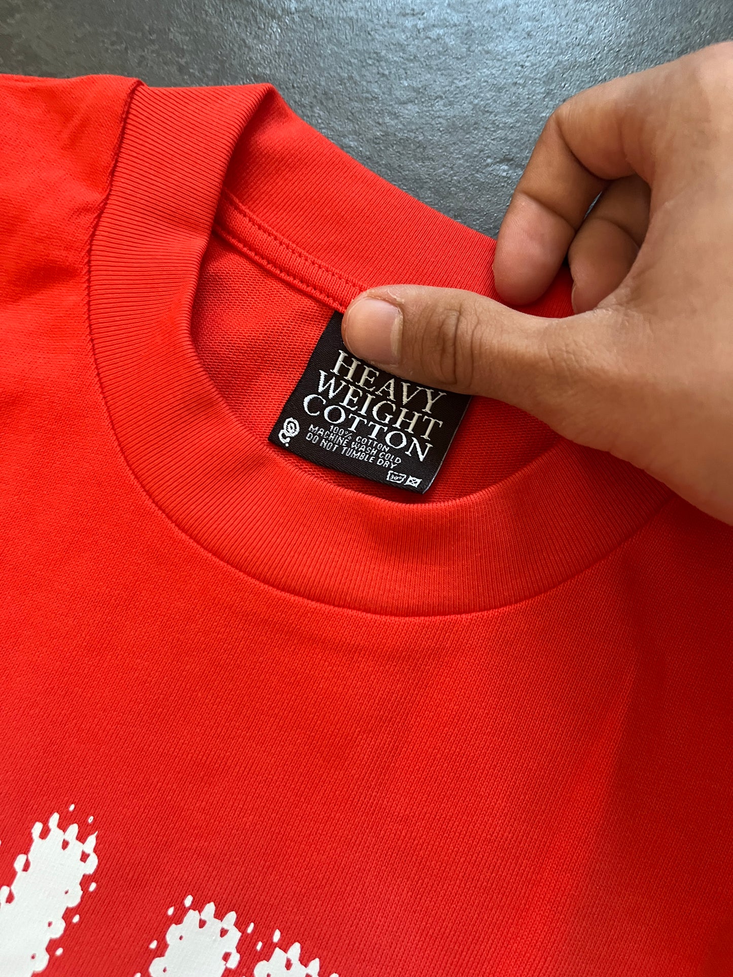 Quratee orange spell out tee